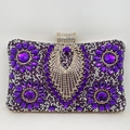 Detailed close-up of a purple rhinestone evening clutch with floral crystal patterns - Purple