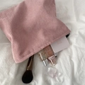 Pink corduroy minimalist makeup pouch on soft white fabric background for daily storage - Lotus Pink
