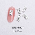 Macro view of silver bow nail charm with teardrop crystal and 6x10mm size detail - Silver Bowknot Water Drop White Crystal Style (8907)