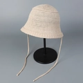 Detailed close-up of breathable knit bucket hat showing soft texture and side straps - M (56-58cm) / Beige