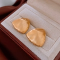 Macro detail of golden matte irregular earrings with brushed metal finish in a gift box - Irregular Matte Gold Geometry (66#)