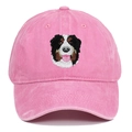Close-up of Bernese Mountain Dog embroidery on a vintage pink washed cotton baseball cap - Pink
