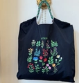 Black nylon tote bag featuring colorful plant embroidery and braided cord handles - Black MZ Floral