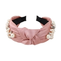 Pink knotted satin headband with white pearl accents and silver beads on a black lining - Lotus Pink