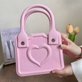 Chic pink EVA beach tote bag featuring embossed heart pattern and stylish double handles - Pink