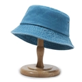 Vintage washed dark blue denim bucket hat with metal eyelets on a wooden head stand - One Size / Lake Blue