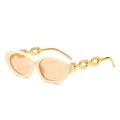 Retro cat-eye sunglasses with cream frames and gold chain temples shown at a 45-degree angle - Rice White Frame / Tea Lens