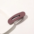 Close-up of matte mauve rectangular hair clip with cutout design on a ceramic plate - Matte Hair Clip Small - Bean Paste Pink