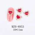 Detail view of 10x11mm heart-shaped alloy nail charms with red gemstones and gold base - Gold Base Red Heart Style (8953)