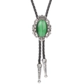 Silver crown bolo tie featuring a green turquoise stone on a black braided leather cord - Green Cat's Eye Stone