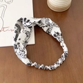 Black and white paisley pattern elastic headband with vintage twisted knot design - White