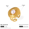 Detail of 8mm pearl ring with golden textured concentric relief on stainless steel band - Concentric Circle Pearl Style (NB-R24339)