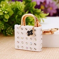 Miniature white quilted purse keychain with sparkling diamonds and gold chain accessory - White Lady Handbag