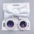 Macro view of white daisy floral sunglasses and waffle bow headband set for toddlers - White