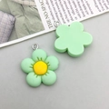Mint green resin flower pendant charm with yellow core and metal hanging loop - Green Resin Small Flower