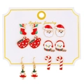 Set of six Christmas themed stud earrings featuring Santa, snowman, and tree on display card - Kc Gold 10957