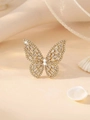 Elegant gold butterfly ring with hollow design and sparkling diamonds on silk background - White + 14K Gold