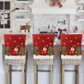 Three red Christmas chair covers with embroidered snowmen on white woven bar stools - Snowman