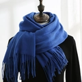 Royal blue cashmere-feel winter scarf featuring classic fringe tassels on black mannequin - Sapphire Blue