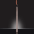 Deep brown metal makeup brush with black bristles and a brown cream swatch on top - Aegyo-sal Brush
