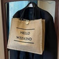 Linen tote bag with Hello Weekend print and black handles for casual daily travel use - Black Hello Weekend Print