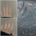3D blue wave nail stickers with silver rhinestones on a professional grey background - Electric Blue Dolphin and Wave Style (CO-405)