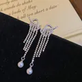 Sparkling silver bow knot fringe earrings with white pearls and crystals - Silver (Silver Pin)