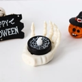Halloween LED candle light with a white skull hand base and spider web pattern - White Skeleton Hand Candle