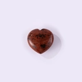 Polished heart-shaped reddish-brown natural stone with unique dark mineral inclusions - Mahogany Obsidian