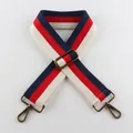 Close-up of adjustable striped handbag strap with antique bronze metal swivel hooks - Red White Blue Stripes