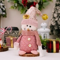 Rosa Schneemannfigur mit Pailletten und Plüschschal auf einem runden Holzsockel - Rosa stehender Schneemann