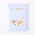 Close-up of light blue PU leather passport cover with gold world map and plane design - Light Blue