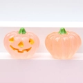 Detail showing two pink 3D luminous resin pumpkins with smiling faces for DIY crafts - Luminous Light Pink (Yellow Expression)