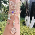 Detail of silver suncatcher with butterfly, moon, and crystal beads for outdoor garden decor - Morganite