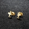 Macro shot of gold ballerina stud earrings with butterfly backs on black textured surface - 132 Ballerina / Gold
