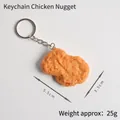 Realistic golden chicken nugget keychain pendant with metal ring on white background - Chicken Nugget Keychain
