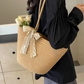 Handwoven straw tote bag with oversized white lace bow detail in a natural beige finish - Khaki no Flower + Scarf