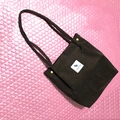 Deep brown corduroy tote bag featuring a white square patch and golden metal snap buttons - Dark Coffee