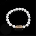 Macro detail of natural howlite beaded bracelet with vintage gold Faith engraved charm - Howlite-Faith