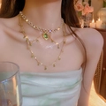 Double-layered gold necklace set with green emerald pendants and pearl choker - Gold-Oval
