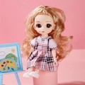 Fashion doll with blonde hair wearing a pink checkered dress and white shoes on pink base - Plaid Dress Girl