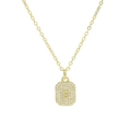 Macro shot of gold square pendant with letter S engraving and pave zircon stones - Necklace S