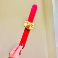 Plush Christmas slap bracelet in red and yellow featuring a lucky cat with Fu character - Fortune Cat