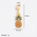 Detail of yellow pineapple alloy pendant with size markings and green leaves detail - Pineapple (60747)