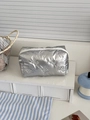 Silver quilted cosmetic bag with embossed bow pattern and a white zipper closure - Without Charm / Silver