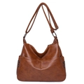 Classic brown PU leather hobo bag with adjustable strap and decorative side zippers - Caramel color