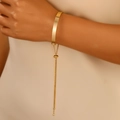 Polished gold adjustable bracelet with flat rectangular plate on female wrist - Golden Flat Plate Adjustable Slide Bracelet (32)
