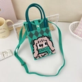 Detail of green knitted phone bag with cartoon dog pattern and metal snap closure - 7-Green and Black Argyle Dog