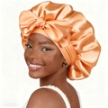 Elastic satin sleep bonnet with a large bow in champagne gold finish for hair care - One Size / Champagne
