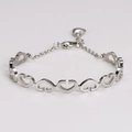 Detail view of silver heart-link bracelet with extension chain and polished finish - Steel